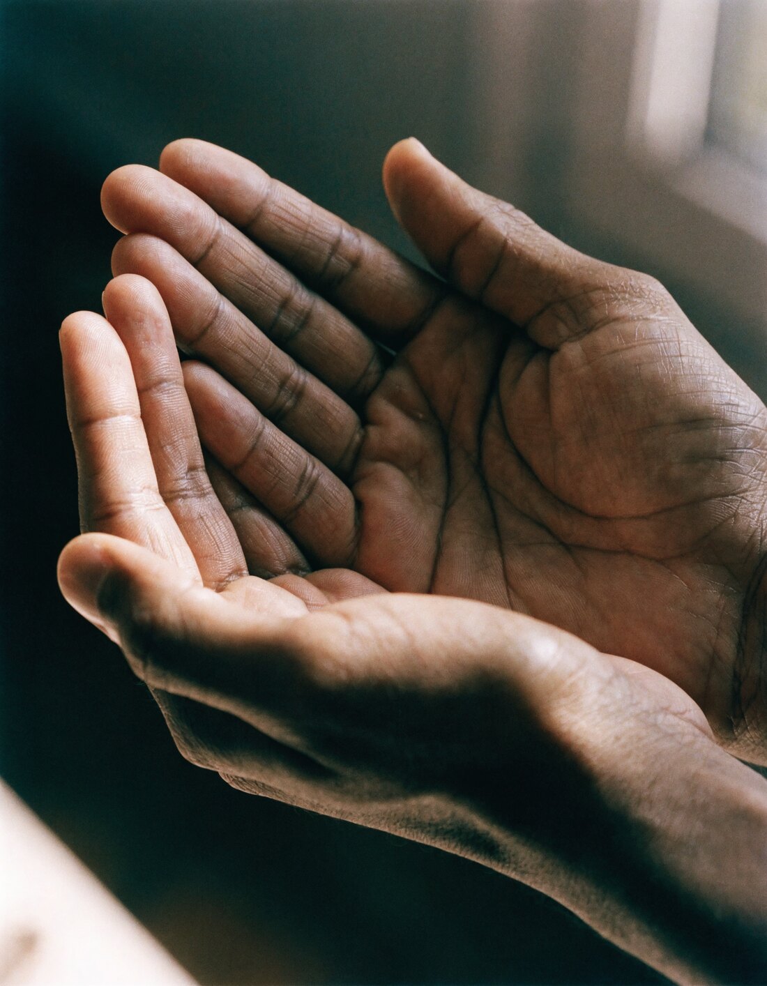 A pair of hands, making